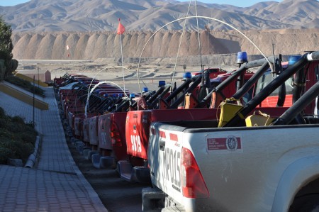 Trucks and stock piles, Radomiro Tomic mine - Chile